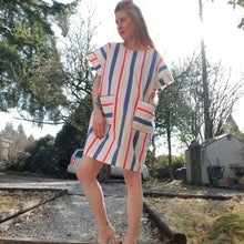 Load image into Gallery viewer, A classic oversized tunic dress for the everyday. Featuring a scoop neckline with an extended shoulder, loose fitting sleeve bands and front patch pockets. This dress will give you all the old school feels of the 80&#39;s, made in a vintage antique washed cotton it&#39;ll have you seeking lil&#39; miss sunshine!
