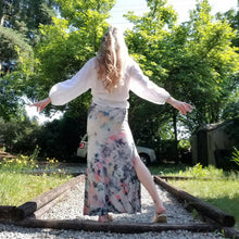 Load image into Gallery viewer, The imagery you&#39;ll discover in these handcrafted beauties is endless. Not only is this the perfect skirt for everyday, it&#39;ll be the most fun you&#39;ll enjoy wearing and having endless conversations about too! The perfect maxi skirt for everyday. Featuring a wide waistband and an A-line body with a long ankle length hem and double side slits. This is a unique and original hand-dyed skirt using non-toxic dyes in our organic bamboo knit fabric that is so luxuriously soft + comfy, you won&#39;t want to take if off!
