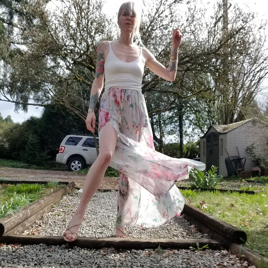 The perfect easy breezy summertime pant for the everyday! Handcrafted in a lightweight watercolor print, these beauties feature a high rise elasticized waist, pockets for that ultra casual feel, these free flowing flared pants feature thigh high front leg slits that'll keep you ultra stylish and oh so cool on those hot summer days and evenings!