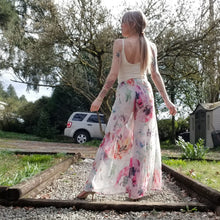 Load image into Gallery viewer, The perfect easy breezy summertime pant for the everyday! Handcrafted in a lightweight watercolor print, these beauties feature a high rise elasticized waist, pockets for that ultra casual feel, these free flowing flared pants feature thigh high front leg slits that&#39;ll keep you ultra stylish and oh so cool on those hot summer days and evenings!
