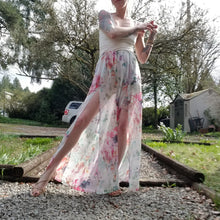 Load image into Gallery viewer, The perfect easy breezy summertime pant for the everyday! Handcrafted in a lightweight watercolor print, these beauties feature a high rise elasticized waist, pockets for that ultra casual feel, these free flowing flared pants feature thigh high front leg slits that&#39;ll keep you ultra stylish and oh so cool on those hot summer days and evenings!
