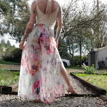 Load image into Gallery viewer, The perfect easy breezy summertime pant for the everyday! Handcrafted in a lightweight watercolor print, these beauties feature a high rise elasticized waist, pockets for that ultra casual feel, these free flowing flared pants feature thigh high front leg slits that&#39;ll keep you ultra stylish and oh so cool on those hot summer days and evenings!
