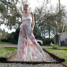 Load image into Gallery viewer, The perfect easy breezy summertime pant for the everyday! Handcrafted in a lightweight watercolor print, these beauties feature a high rise elasticized waist, pockets for that ultra casual feel, these free flowing flared pants feature thigh high front leg slits that&#39;ll keep you ultra stylish and oh so cool on those hot summer days and evenings!
