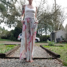 Load image into Gallery viewer, The perfect easy breezy summertime pant for the everyday! Handcrafted in a lightweight watercolor print, these beauties feature a high rise elasticized waist, pockets for that ultra casual feel, these free flowing flared pants feature thigh high front leg slits that&#39;ll keep you ultra stylish and oh so cool on those hot summer days and evenings!
