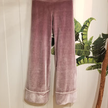 Load image into Gallery viewer, A darling pajama pant for everyday. Made in a luxurious stretch velvet, this pant features a medium to high rise fit with a wide waistband, back patch pockets + side pom pom detailing that runs down the side of this cropped length relaxed leg. Perfectly chic for lounging day or night!
