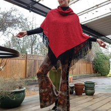 Load image into Gallery viewer, Elevate your look with this one of a kind poncho! The deep red color is perfect for the Fall/Winter season, and heavy lace fabric has a beautiful weighted feel and features a fringed edge that create a very chic and fine finish to any outfit on it&#39;s own or layered over your favorite jean jacket or coat! You will enjoy this piece for year&#39;s to come!
