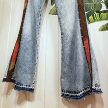 Load image into Gallery viewer, Your wardrobe will thank you and your booty will love you with these 70&#39;s inspired UPCYCLED Driftwood Jeans. Featuring embroidered suede patchwork tuxedo side panels accented with gold studs, also found on the back pockets, and 3 hand embroidered script&#39;s including our signature &#39;LOVED&#39; and &#39;ROCK STAR&#39; found on the bottom bsck legs, because we all have an inner rock star and we should all feel loved, everyday!&nbsp;
