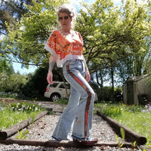 Load image into Gallery viewer, Your wardrobe will thank you and your booty will love you with these 70&#39;s inspired UPCYCLED Driftwood Jeans. Featuring embroidered suede patchwork tuxedo side panels accented with gold studs, also found on the back pockets, and 3 hand embroidered script&#39;s including our signature &#39;LOVED&#39; and &#39;ROCK STAR&#39; found on the bottom bsck legs, because we all have an inner rock star and we should all feel loved, everyday!&nbsp;
