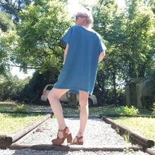 Load image into Gallery viewer, A classic oversized tunic dress for the everyday. This is a 2&quot; shorter version than our regular Banded Freedom Dress. Featuring a scoop neckline with an extended shoulder with loose fitting sleeve bands + patch pockets. Designed for the days spent lounging around the house, playing in the garden, reading a good book + working in your home office, this dress is so versatile. Feel the comfort in this style + the freedom to do it!
