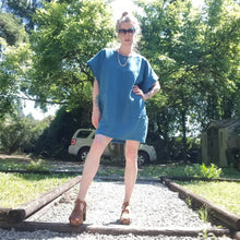 Load image into Gallery viewer, A classic oversized tunic dress for the everyday. This is a 2&quot; shorter version than our regular Banded Freedom Dress. Featuring a scoop neckline with an extended shoulder with loose fitting sleeve bands + patch pockets. Designed for the days spent lounging around the house, playing in the garden, reading a good book + working in your home office, this dress is so versatile. Feel the comfort in this style + the freedom to do it!
