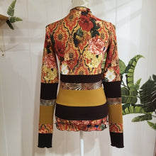 Load image into Gallery viewer, Unique on it&#39;s own or layer up this beauty! A one of a kind classic fitted mock neck top featuring x-long sleeves, handcrafted in a mixed patchwork of earth tones, art deco florals, liquid waves and 2-tone organic ribbed knits. Slip this beauty on and set your mark for the day!
