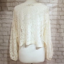 Load image into Gallery viewer, A sweet romantic top for everyday. Featuring a scoop neckline, long balloon sleeves and a loose flowy waist length hemline. Wear freely on it&#39;s own or layer with any of our tops for a unique vintage feeling topper look. Handcrafted in a luscious cream colored corded floral lace, so perfect for day to night in complete romantic style!
