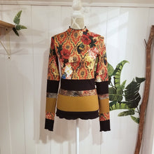 Load image into Gallery viewer, Unique on it&#39;s own or layer up this beauty! A one of a kind classic fitted mock neck top featuring x-long sleeves, handcrafted in a mixed patchwork of earth tones, art deco florals, liquid waves and 2-tone organic ribbed knits. Slip this beauty on and set your mark for the day!
