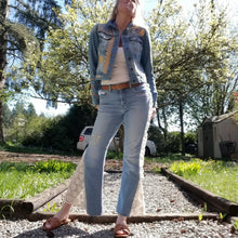 Load image into Gallery viewer, A complete labor of LOVE! This ONE OF A KIND upcycled denim jean jacket is sure to be your new favorite go-to. Featuring dragonfly inspired leather appliqued patchworks throughout the entire jacket in tones of yellow, mauve and earth. The unique vintage scalloped lace down the front and small crochet trim accents are highlighted with 10mm gold pyramid studs. You will also find our signature hand-embroidered &quot;LOVED&quot; script on the left sleeve at the cuff. Scoop up this beauty and feel loved everyday!
