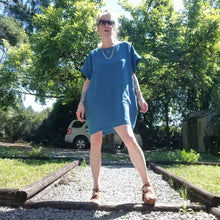 Load image into Gallery viewer, A classic oversized tunic dress for the everyday. This is a 2&quot; shorter version than our regular Banded Freedom Dress. Featuring a scoop neckline with an extended shoulder with loose fitting sleeve bands + patch pockets. Designed for the days spent lounging around the house, playing in the garden, reading a good book + working in your home office, this dress is so versatile. Feel the comfort in this style + the freedom to do it!
