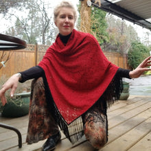 Load image into Gallery viewer, Elevate your look with this one of a kind poncho! The deep red color is perfect for the Fall/Winter season, and heavy lace fabric has a beautiful weighted feel and features a fringed edge that create a very chic and fine finish to any outfit on it&#39;s own or layered over your favorite jean jacket or coat! You will enjoy this piece for year&#39;s to come!
