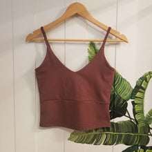 Load image into Gallery viewer, The ultimate in comfort for everyday. This classic crop style tank features a V-neck design front and back, a double layer upper body for added support + coverage, an under bust seam, thin straps and comfortable just past waist length for an effortless feel and minimal chic look!
