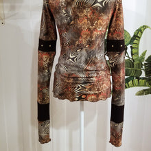 Load image into Gallery viewer, Unique on it&#39;s own or layer up this beauty! A classic fitted mock neck top featuring x-long sleeves, handcrafted in a silky liquid effect floral wave print, ribbed patchwork design boasting gold riveting, each detail as original as the wearer. Slip this beauty on and set your mark for the day!
