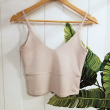 Load image into Gallery viewer, The ultimate in comfort for everyday. This classic crop style tank features a V-neck design front and back, a double layer upper body for added support + coverage, an under bust seam, thin straps and comfortable just past waist length for an effortless feel and minimal chic look!
