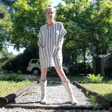 Load image into Gallery viewer, A classic oversized tunic dress for the everyday. This is a 2&quot; shorter version than our regular Banded Freedom Dress. Featuring a scoop neckline with an extended shoulder with loose fitting sleeve bands + patch pockets. Designed for the days spent lounging around the house, playing in the garden, reading a good book + working in your home office, this dress is so versatile. Feel the comfort in this style + the freedom to do it!
