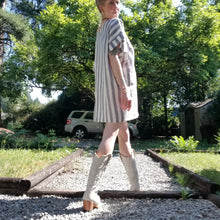 Load image into Gallery viewer, A classic oversized tunic dress for the everyday. This is a 2&quot; shorter version than our regular Banded Freedom Dress. Featuring a scoop neckline with an extended shoulder with loose fitting sleeve bands + patch pockets. Designed for the days spent lounging around the house, playing in the garden, reading a good book + working in your home office, this dress is so versatile. Feel the comfort in this style + the freedom to do it!
