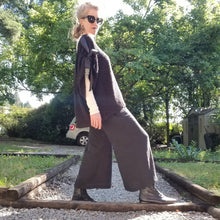 Load image into Gallery viewer, These are a summertime staple + a travelbug&#39;s favorite. Featuring a simple elasticized stretch waist and hidden pockets in the side seams. These 3/4 length wide leg flared gaucho&#39;s are the perfect everyday go-to pant if your looking for classic simplicity! Pair these with any of our tops or ponchos for a favorite summertime outfit!
