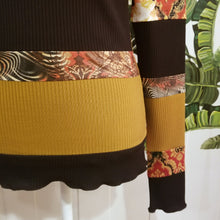 Load image into Gallery viewer, Unique on it&#39;s own or layer up this beauty! A one of a kind classic fitted mock neck top featuring x-long sleeves, handcrafted in a mixed patchwork of earth tones, art deco florals, liquid waves and 2-tone organic ribbed knits. Slip this beauty on and set your mark for the day!
