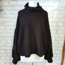 Load image into Gallery viewer, The perfect light yet warm sweater for everyday! Layer this ultra chic loose and flowy wool sweater over all your favorite tops for a perfect lightweight addition with some added warmth, featuring a wide slouch turtleneck in a lusciously soft sweater rib knit, also found on the cuffs, big balloon sleeves featuring our signature leather heart patches and a nice scoop back.
