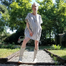 Load image into Gallery viewer, A classic oversized tunic dress for the everyday. This is a 2&quot; shorter version than our regular Banded Freedom Dress. Featuring a scoop neckline with an extended shoulder with loose fitting sleeve bands + patch pockets. Designed for the days spent lounging around the house, playing in the garden, reading a good book + working in your home office, this dress is so versatile. Feel the comfort in this style + the freedom to do it!
