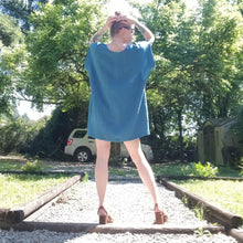 Load image into Gallery viewer, A classic oversized tunic dress for the everyday. This is a 2&quot; shorter version than our regular Banded Freedom Dress. Featuring a scoop neckline with an extended shoulder with loose fitting sleeve bands + patch pockets. Designed for the days spent lounging around the house, playing in the garden, reading a good book + working in your home office, this dress is so versatile. Feel the comfort in this style + the freedom to do it!
