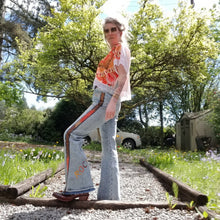 Load image into Gallery viewer, Your wardrobe will thank you and your booty will love you with these 70&#39;s inspired UPCYCLED Driftwood Jeans. Featuring embroidered suede patchwork tuxedo side panels accented with gold studs, also found on the back pockets, and 3 hand embroidered script&#39;s including our signature &#39;LOVED&#39; and &#39;ROCK STAR&#39; found on the bottom back legs, because we all have an inner rock star and we should all feel loved, everyday!
