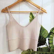 Load image into Gallery viewer, The ultimate in comfort for everyday. This classic crop style tank features a V-neck design front and back, a double layer upper body for added support + coverage, an under bust seam, thin straps and comfortable just past waist length for an effortless feel and minimal chic look!
