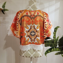 Load image into Gallery viewer, A bright and fun free flow patchwork top for everyday! Featuring a classic V-neck, this one sized top has a mandala motif print satin back and a contrasting mini red pinstripe linen in the back and is detailed with beautiful scalloped lace along the top shoulders, sleeves and hemline, creating a perfectly chic + effortless look you can pair with everything in your wardrobe. Slip on this beauty and feel the love!
