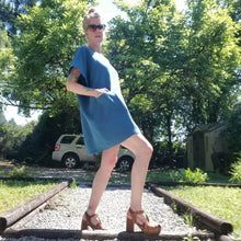 Load image into Gallery viewer, A classic oversized tunic dress for the everyday. This is a 2&quot; shorter version than our regular Banded Freedom Dress. Featuring a scoop neckline with an extended shoulder with loose fitting sleeve bands + patch pockets. Designed for the days spent lounging around the house, playing in the garden, reading a good book + working in your home office, this dress is so versatile. Feel the comfort in this style + the freedom to do it!
