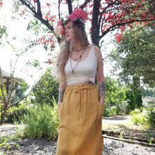 Load image into Gallery viewer, A classic super relaxed fit skirt for the everyday. Featuring an elasticized waist with a drawstring, patch pockets and double side slits at hem. Designed for the days spent lounging around the house, playing in the garden, reading a good book + working in your home office, this skirt is so versatile. Feel the comfort in this style + the freedom to do it!
