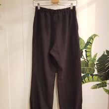 Load image into Gallery viewer, A classic easy fit pant for the everyday. Featuring elasticized waist + ankles as well as pockets in the side seams. Designed for the days spent lounging around the house, playing in the garden, reading a good book + working in your home office, these pants are so versatile. Feel the comfort in this style + the freedom to do it!
