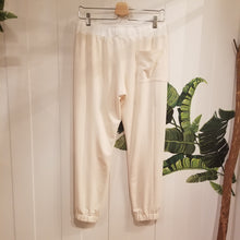 Load image into Gallery viewer, A classic medium rise tapered leg pant for the everyday. Featuring a wide stretch rib knit waistband with a drawstring and front and back pockets. Designed for everything from lounging, playing + working whether it&#39;s in your home office or on the go, these pants are so versatile and ultra comfy cozy you won&#39;t want to take them off!
