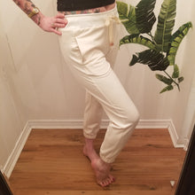 Load image into Gallery viewer, A classic medium rise tapered leg pant for the everyday. Featuring a wide stretch rib knit waistband with a drawstring and front and back pockets. Designed for everything from lounging, playing + working whether it&#39;s in your home office or on the go, these pants are so versatile and ultra comfy cozy you won&#39;t want to take them off!
