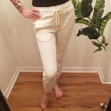 Load image into Gallery viewer, A classic medium rise tapered leg pant for the everyday. Featuring a wide stretch rib knit waistband with a drawstring and front and back pockets. Designed for everything from lounging, playing + working whether it&#39;s in your home office or on the go, these pants are so versatile and ultra comfy cozy you won&#39;t want to take them off!
