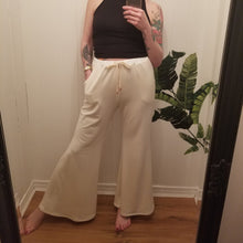 Load image into Gallery viewer, A classic high waist relaxed flare pant for the everyday. Featuring an elasticized waist with drawstring and pockets. Designed for everything from lounging, playing + working whether it&#39;s in your home office or on the go, these pants are so versatile and ultra comfy cozy you won&#39;t want to take them off!
