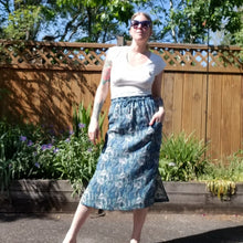 Load image into Gallery viewer, A classic super relaxed fit skirt for the everyday. Featuring an elasticized waist with a drawstring, patch pockets and double side slits at hem. Designed for the days spent lounging around the house, playing in the garden, reading a good book + working in your home office, this skirt is so versatile. Feel the comfort in this style + the freedom to do it!
