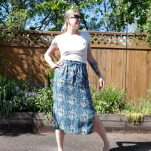 Load image into Gallery viewer, A classic super relaxed fit skirt for the everyday. Featuring an elasticized waist with a drawstring, patch pockets and double side slits at hem. Designed for the days spent lounging around the house, playing in the garden, reading a good book + working in your home office, this skirt is so versatile. Feel the comfort in this style + the freedom to do it!
