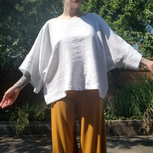 Load image into Gallery viewer, A classic oversized tunic top for the everyday. Featuring a scoop neckline with an extended shoulder with loose fitting sleeve bands. Designed for the days spent lounging around the house, playing in the garden, reading a good book + working in your home office, this top is so versatile. Feel the comfort in this style + the freedom to do it!
