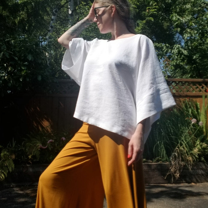 A classic oversized tunic top for the everyday. Featuring a scoop neckline with an extended shoulder with loose fitting sleeve bands. Designed for the days spent lounging around the house, playing in the garden, reading a good book + working in your home office, this top is so versatile. Feel the comfort in this style + the freedom to do it!