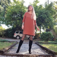 Load image into Gallery viewer, A classic 3/4 sleeve tunic dress with a scoop neck, easy fit sleeve and body with a scoop hem ending above knee length and side seam pockets. Designed for everyday living. Feel the comfort in this style + the freedom to do it!
