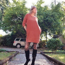 Load image into Gallery viewer, A classic 3/4 sleeve tunic dress with a scoop neck, easy fit sleeve and body with a scoop hem ending above knee length and side seam pockets. Designed for everyday living. Feel the comfort in this style + the freedom to do it!
