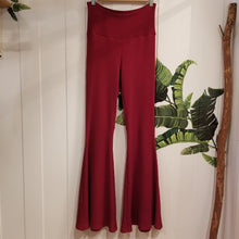 Load image into Gallery viewer, Absolute chic coziness in these must have flares! Featuring a wide waistband, the leg is fitted to the knees and flow out into a super flared hem, just slip on up these classics and have fun mixing + matching them with all of our other knit styles as well as everything else in your wardrobe!
