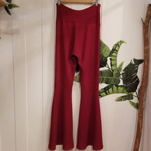 Load image into Gallery viewer, Absolute chic coziness in these must have flares! Featuring a wide waistband, the leg is fitted to the knees and flow out into a super flared hem, just slip on up these classics and have fun mixing + matching them with all of our other knit styles as well as everything else in your wardrobe!
