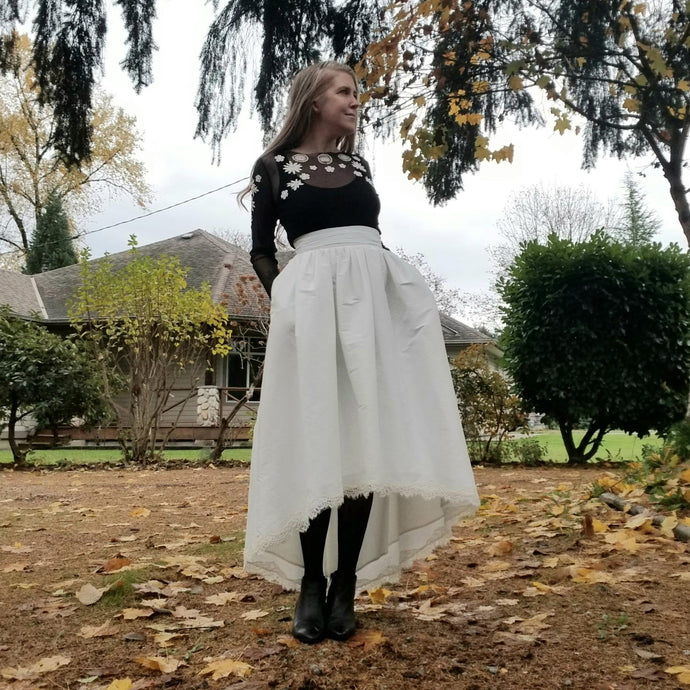 An ultra sweet Hi-Lo styled bridal skirt with elegant scalloped lace hem edge. Featuring a fitted ruched waistband and a fully gathered skirt that flows into a full a-line shaped skirt. The perfect skirt for a Bride-to-be, whether it be a cocktail style wedding, simple country setting, a destination wedding or elopement!