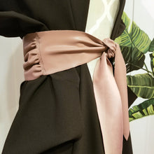 Load image into Gallery viewer, This lovely plush back vegan leather belt features a clean raw finished edge that features gathering at the side seams and 2 pointed tail ends. A great wardrobe staple as you can take this belt style and wrap it, knot it, bow it, tie it any way you like around any of your shirts, blouses, lightweight sweaters, tops or dresses. Create a slimming silhouette today with this great piece!
